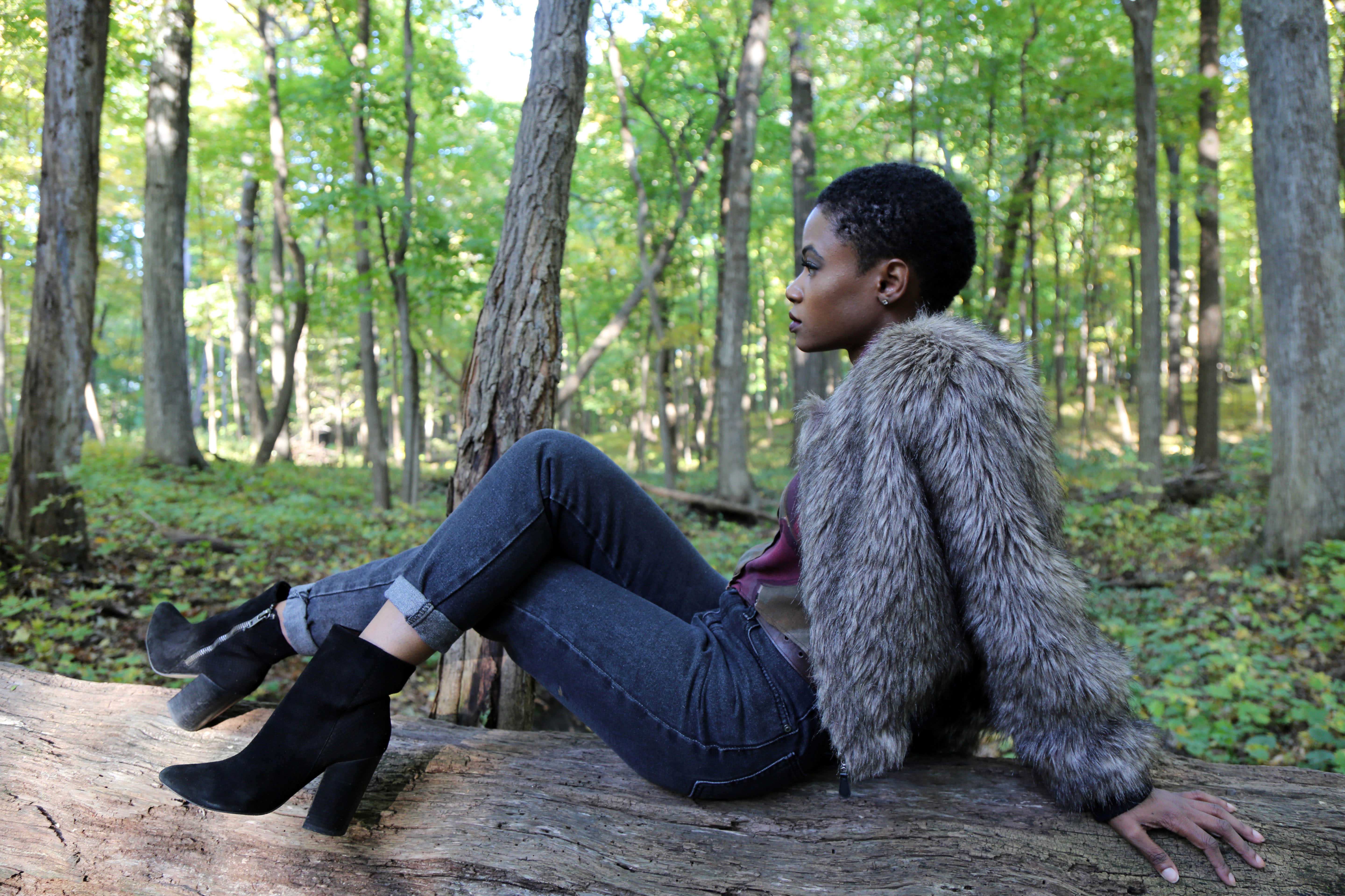 High-waist denim jeans and pattern blouse with fur coat