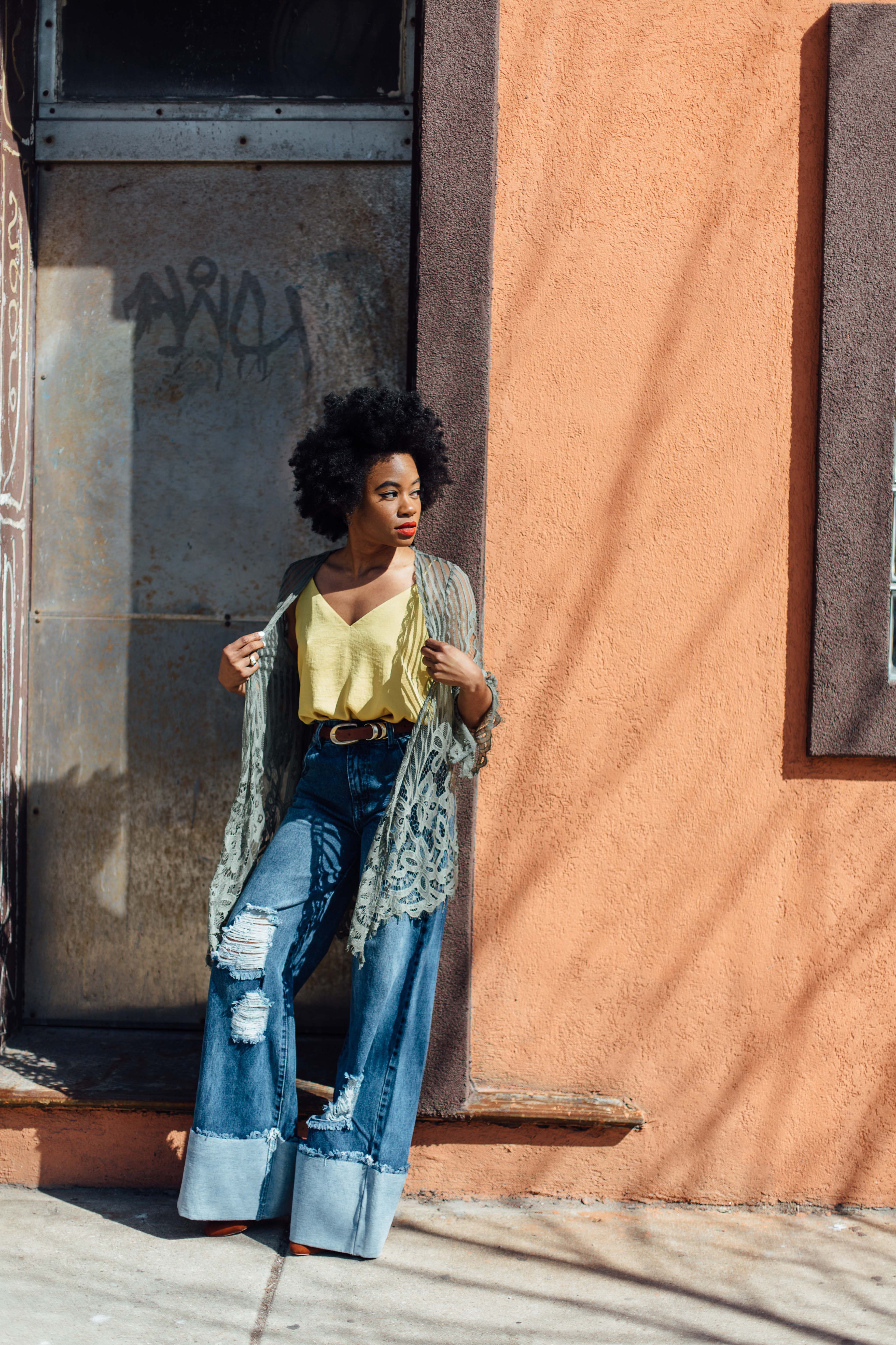 Wide leg denim jeans and gold tank