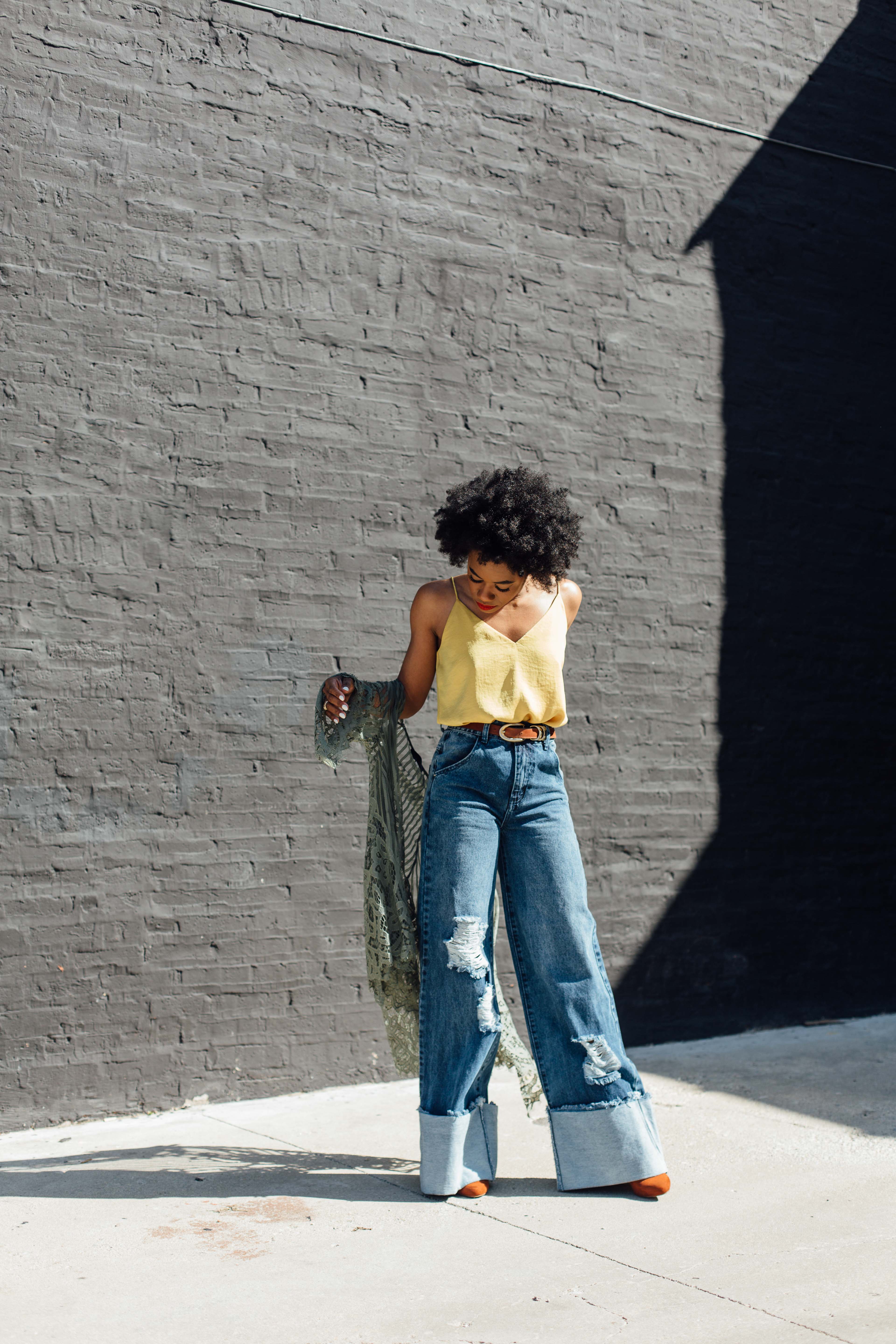 Wide leg denim jeans and gold tank